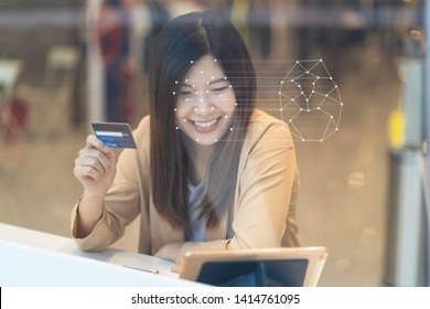 Asian women using the technology tablet for access control by face recognition in private identification step when online shopping with the credit card, credit card mockup, online payment concept, - Powered by Shutterstock