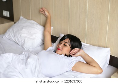 asian women waking up. Woman waking up at morning.