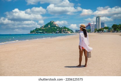 Asian women walking on the beach in the morning at Takiab Beach Huahin Thailand