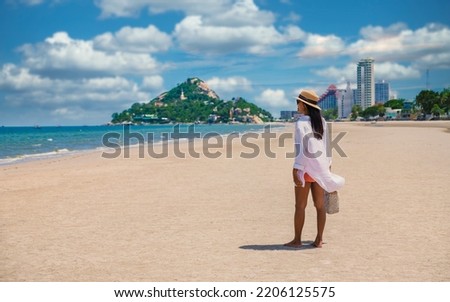Asian women walking on the beach in the morning at Takiab Beach Huahin Thailand