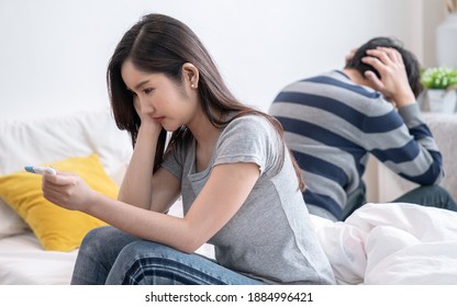 Asian women were stressed when they saw pregnancy test results, She is not ready to have children, Accidental pregnancy. - Powered by Shutterstock