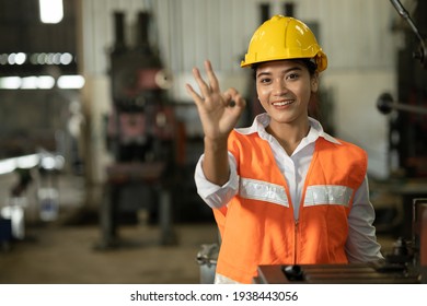 Asian Women Worker Hand Showing OK Or Good Job Done No Problem Sign In Working Factory.