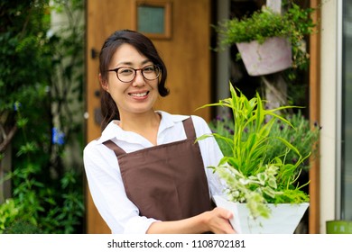 Asian Women Working In A Flower Shop