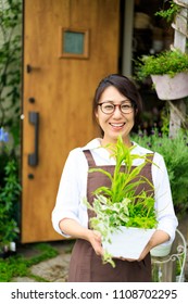 Asian Women Working In A Flower Shop