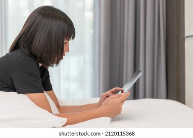 Asian Women Working On Laptop At Room. Concept Of Work Form Home. Portrait Women Smile Use Technology Mobile. Concept Business.