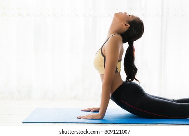 Asian Women Are Yoga Exercises At Home