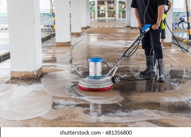 Asian Worker Cleaning Sand Wash Exterior Walkway Using Polishing Machine And Chemical Or Acid