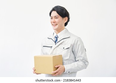 Asian Worker Having The Cardboard Box  In White Background