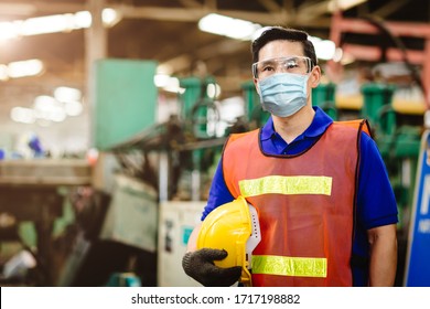 Asian Worker Wear Disposable Face Mask For Protection Corona Virus Spreading And Smoke Dust Air Pollution Filter In Factory For Healthy Labor Care.