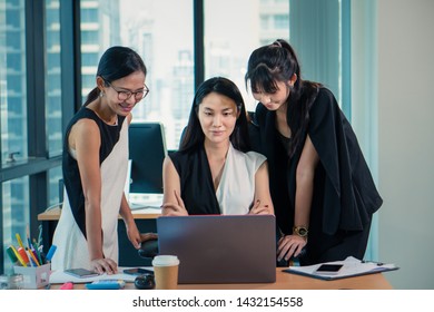 Asian Working Women Woking Together In Office