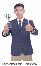 Asian young attractive handsome business man with silver cup, in winning concept, isolated on white background