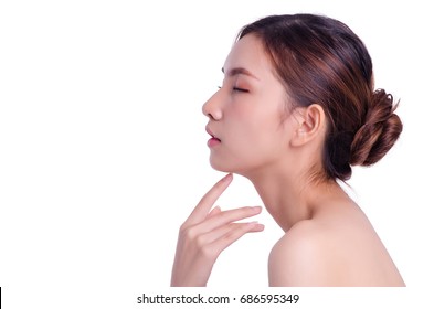 asian young beautiful woman smiling and touching her face, isolated over white background. natural makeup, SPA therapy, skincare, cosmetology and plastic surgery concept