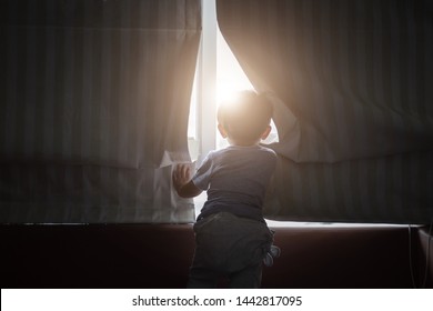 Asian Young Boy Opening The Window