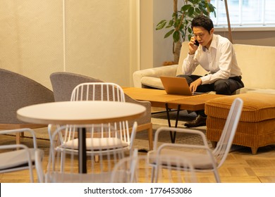 Asian Young Business Man Working In Office