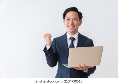 Asian Young Businessman Using Laptop