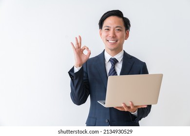 Asian Young Businessman Using Laptop