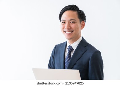 Asian Young Businessman Using Laptop