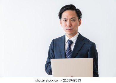 Asian Young Businessman Using Laptop