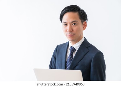 Asian Young Businessman Using Laptop