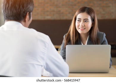 Asian Young Businesswoman Attending Listening To Employee Is Talking At Office.