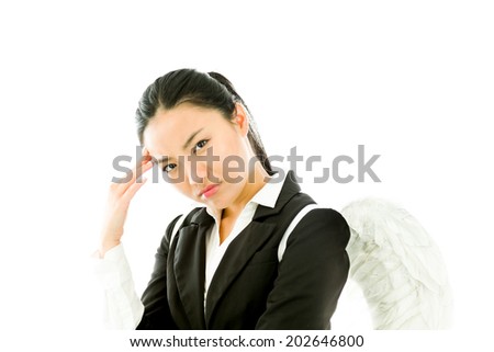 Asian young businesswoman dressed up as white angel suffering from headache isolated on white background