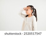 Asian young child unhappy what smell disgust expression squeezing nose with fingers. Kid girl kindergarten have something stinks bad smell situation, studio shot isolated on white background