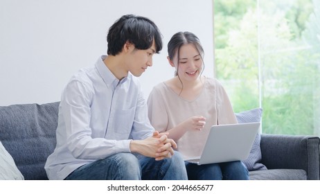 Asian young couple using a computer
