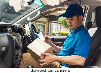 Asian young delivery man courier in uniform hold documents clipboard checking list parcel post boxes inside a car for service shipment to customer, Online shopping service concepts