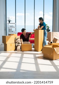 Asian Young Entrepreneur Boy And Girl Packing Parcel Post Such As Square And Tall Box For Send Product Online To Customer In Storehouse