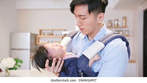 asian young father comforting crying baby and feel nervous at home