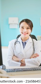 Asian Young Female Doctor Smile At You With Cross Arm In The Clinic Or Hospital