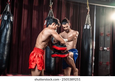 Asian young fitness trainer support Caucasian sportsman doing boxing. Attractive athlete boxer people workout and exercise by practice punching with coach for health care at gym stadium club. - Powered by Shutterstock