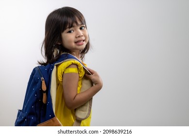  Asian Young Girl Showing Her Arm With Yellow Bandage After Got Vaccinated Or Inoculation, Child Immunization, Covid Delta Vaccine Concept