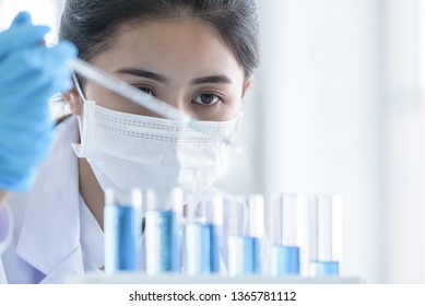 Asian Young Girl Student Scientist Researching  And Learning In A Laboratory.