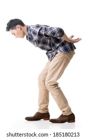 Asian Young Guy Carry Or Take Something, Full Length Model Isolated On White.