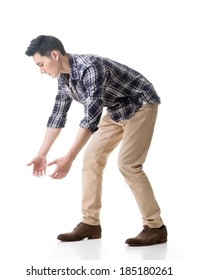 Asian Young Guy Carry Or Take Something, Full Length Model Isolated On White.