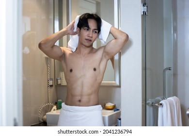 Asian Young Handsome Man Holding Towel In Bathroom