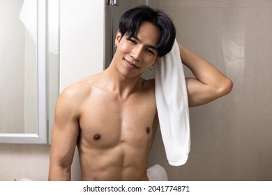 Asian Young Handsome Man Holding Towel In Bathroom