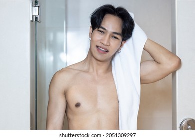 Asian Young Handsome Man Holding Towel In Bathroom