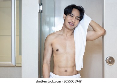 Asian Young Handsome Man Holding Towel In Bathroom