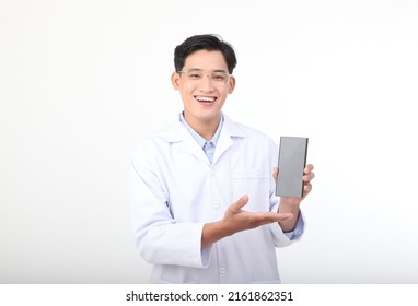 Asian Young Handsome Medical Nursery Staff Show Smart Phone Screen, In Doctor Blouse Coat Isolated On White Background