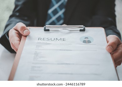 Asian young holding resume applying to apply for a job