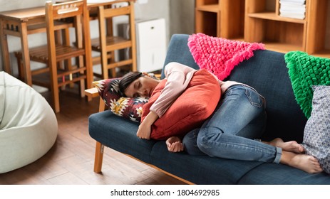 Asian Young Housewife Sleep On Sofa At Home