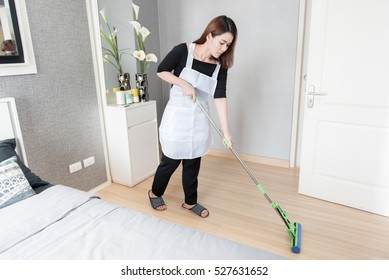 Asian Young Maid Cleaning Floor With Mop At Home, Cleaning Service Concept