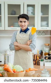 Asian Young Man Is Cooking