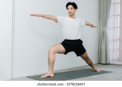 Asian Young Man Doing Yoga At Home