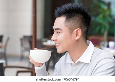 Asian Young Man Drinking Coffee