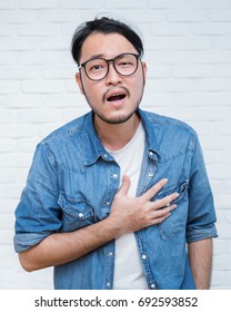 Asian Young Man Having Heart Attack- Close Up Portrait Asian Nerdy Man