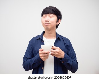 Asian Young Man Holding Coffee Cup Feeling Relax