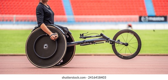 Asian young man para-athletes disabled practice handcycling in stadium. Attractive amputee male runner exercise and practicing workout for Paralympics competition regardless of physical limitations. - Powered by Shutterstock